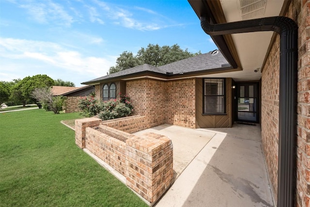 1107 Timmons Dr, Copperas Cove, TX 76522 - doorway to property with a yard, brick siding, and a patio