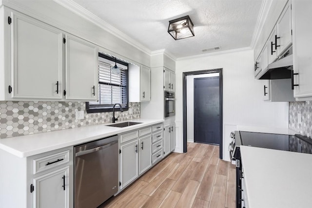 1107 Timmons Dr, Copperas Cove, TX 76522 - kitchen featuring stainless steel dishwasher, electric stove, under cabinet range hood, crown molding, and light wood-style floors