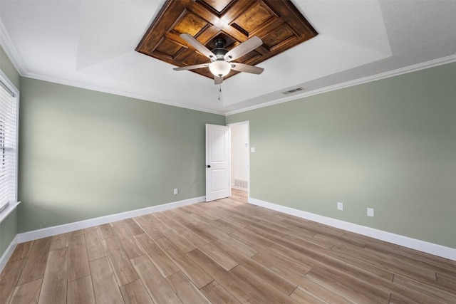 1107 Timmons Dr, Copperas Cove, TX 76522 - spare room with a tray ceiling, light wood-style flooring, a ceiling fan, and ornamental molding