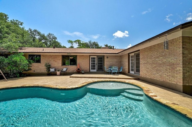 5912 Highland Hills Dr, Austin, TX 78731 - swimming pool with french doors and a patio