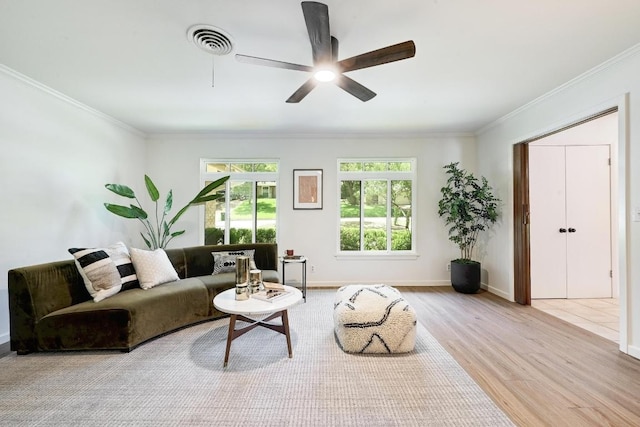 5912 Highland Hills Dr, Austin, TX 78731 - living room with wood finished floors, ornamental molding, and a ceiling fan