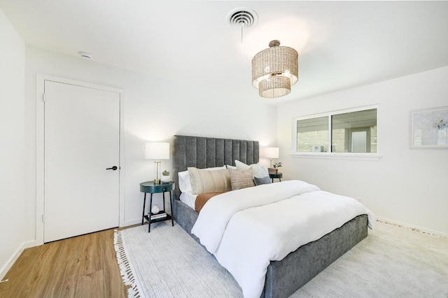 5912 Highland Hills Dr, Austin, TX 78731 - bedroom with wood finished floors and baseboards
