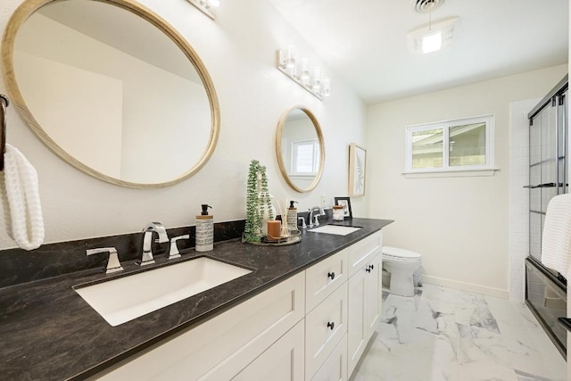 5912 Highland Hills Dr, Austin, TX 78731 - bathroom with marble look tiles, double vanity, and an enclosed shower