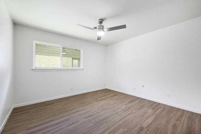 5912 Highland Hills Dr, Austin, TX 78731 - unfurnished room featuring wood finished floors and a ceiling fan