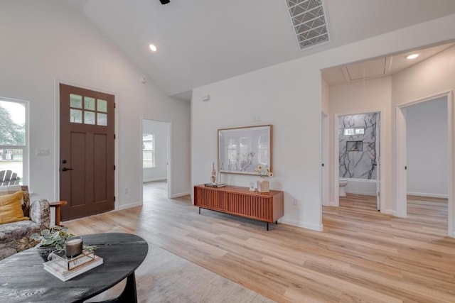 815 Fir Ln, Lockhart, TX 78644 - foyer entrance with high vaulted ceiling, light wood-type flooring, and recessed lighting