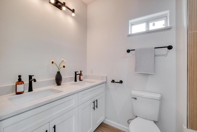 815 Fir Ln, Lockhart, TX 78644 - bathroom featuring toilet and double vanity