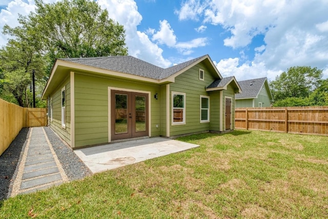 815 Fir Ln, Lockhart, TX 78644 - rear view of house with a fenced backyard, a patio area, french doors, and roof with shingles