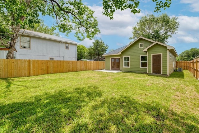 815 Fir Ln, Lockhart, TX 78644 - fenced backyard featuring french doors