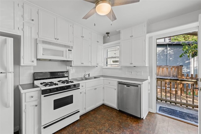 1301 Piedmont Ave, Austin, TX 78757 - kitchen featuring white appliances, white cabinets, a ceiling fan, decorative backsplash, and light countertops