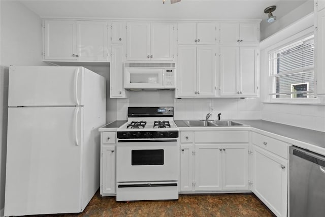 1301 Piedmont Ave, Austin, TX 78757 - kitchen with white appliances, white cabinetry, and light countertops