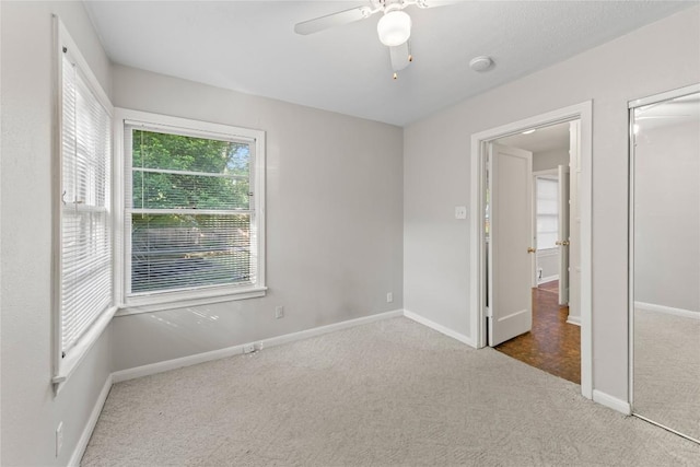 1301 Piedmont Ave, Austin, TX 78757 - unfurnished bedroom featuring carpet, a ceiling fan, and a closet