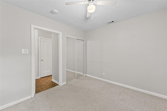 1301 Piedmont Ave, Austin, TX 78757 - unfurnished bedroom with carpet, a closet, and a ceiling fan