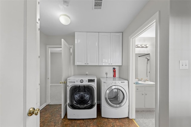 1301 Piedmont Ave, Austin, TX 78757 - laundry room featuring separate washer and dryer and cabinet space