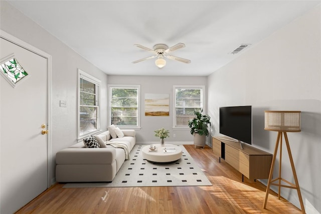 1301 Piedmont Ave, Austin, TX 78757 - living room with a ceiling fan and wood finished floors