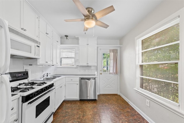 1301 Piedmont Ave, Austin, TX 78757 - kitchen featuring white appliances, white cabinetry, light countertops, and ceiling fan