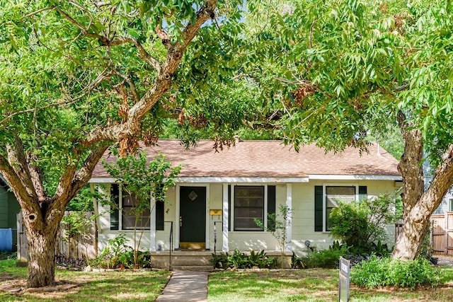 1301 Piedmont Ave, Austin, TX 78757 - bungalow featuring roof with shingles and a porch