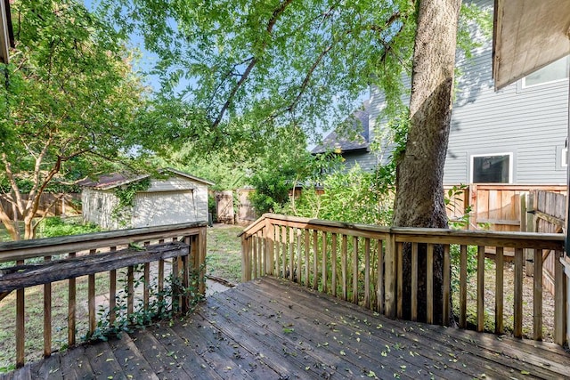 1301 Piedmont Ave, Austin, TX 78757 - wooden deck featuring a fenced backyard and an outdoor structure