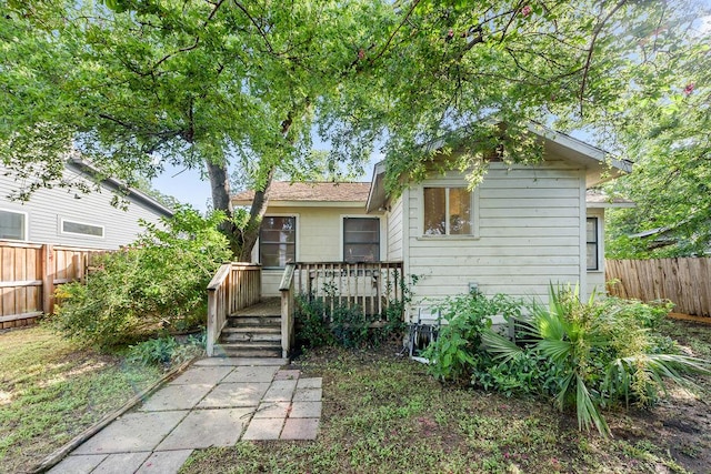 1301 Piedmont Ave, Austin, TX 78757 - rear view of house featuring a fenced backyard and a wooden deck
