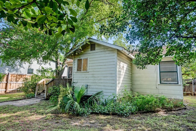 1301 Piedmont Ave, Austin, TX 78757 - view of side of home with a wooden deck