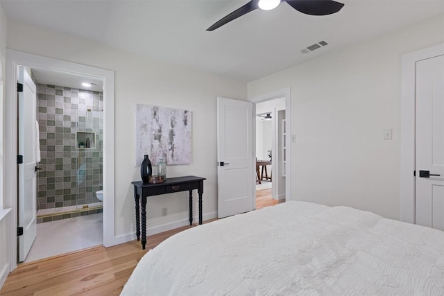 6209 Waycross Dr, Austin, TX 78745 - bedroom with light wood-style flooring, ensuite bath, and a ceiling fan