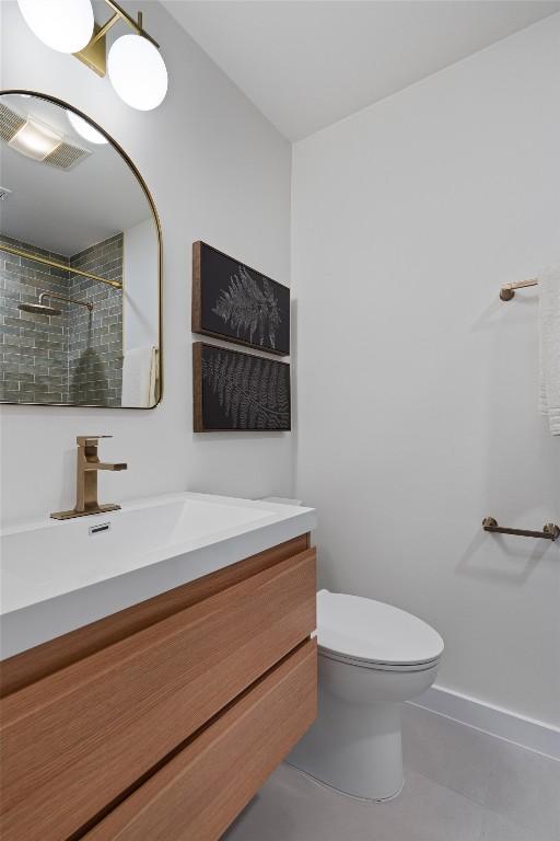 6209 Waycross Dr, Austin, TX 78745 - bathroom featuring vanity, tiled shower, and tile patterned floors