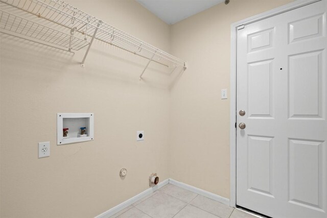 301 River Crossing Trl, Round Rock, TX 78665 - laundry room featuring electric dryer hookup, washer hookup, light tile patterned floors, and hookup for a gas dryer