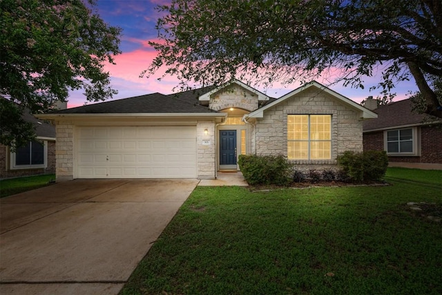 301 River Crossing Trl, Round Rock, TX 78665 - single story home featuring driveway, stone siding, an attached garage, and a lawn