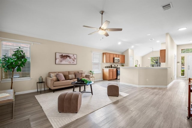 301 River Crossing Trl, Round Rock, TX 78665 - living area with vaulted ceiling, light wood finished floors, ceiling fan, and recessed lighting