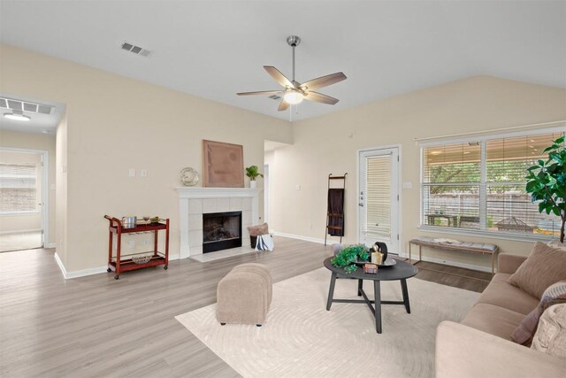 301 River Crossing Trl, Round Rock, TX 78665 - living area featuring light wood-style floors, healthy amount of natural light, ceiling fan, a fireplace, and lofted ceiling
