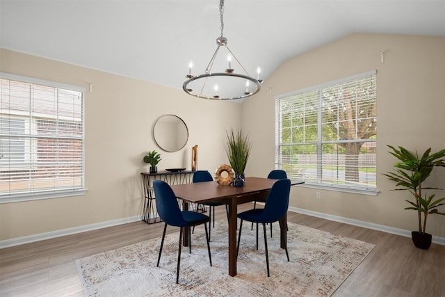 301 River Crossing Trl, Round Rock, TX 78665 - dining area featuring healthy amount of natural light, a chandelier, light wood finished floors, and lofted ceiling