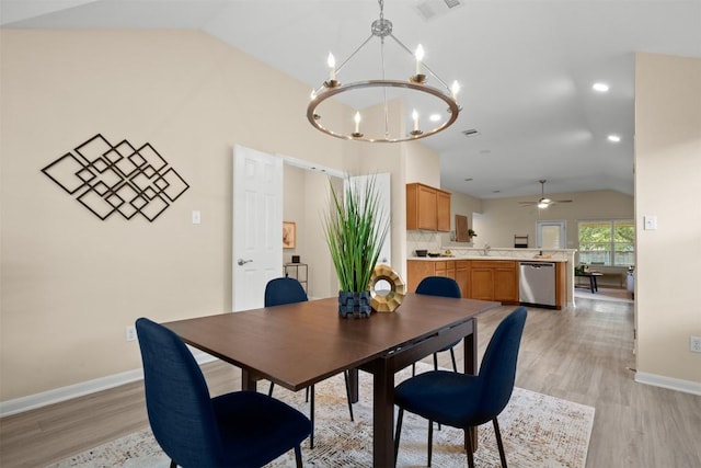 301 River Crossing Trl, Round Rock, TX 78665 - dining space featuring lofted ceiling, a chandelier, light wood-style floors, and a ceiling fan
