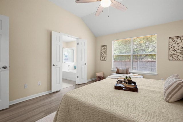 301 River Crossing Trl, Round Rock, TX 78665 - bedroom with wood finished floors, lofted ceiling, connected bathroom, and a ceiling fan