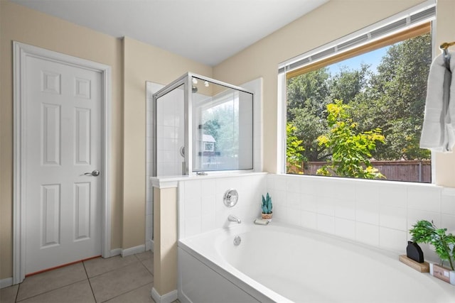 301 River Crossing Trl, Round Rock, TX 78665 - full bathroom featuring a bath, tile patterned flooring, and a stall shower