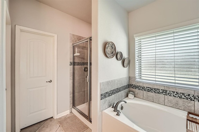 18920 Still Pond Rd, Pflugerville, TX 78660 - bathroom with a bath, a stall shower, and tile patterned floors