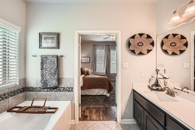 18920 Still Pond Rd, Pflugerville, TX 78660 - ensuite bathroom featuring vanity, a bath, tile patterned flooring, and ceiling fan