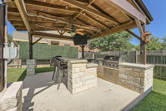 18920 Still Pond Rd, Pflugerville, TX 78660 - fenced backyard featuring exterior kitchen, ceiling fan, a patio, and a gazebo