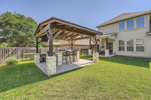 18920 Still Pond Rd, Pflugerville, TX 78660 - fenced backyard with a patio area, ceiling fan, and a gazebo