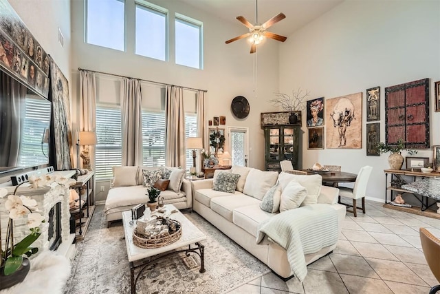 18920 Still Pond Rd, Pflugerville, TX 78660 - living room with a high ceiling, ceiling fan, healthy amount of natural light, and tile patterned flooring
