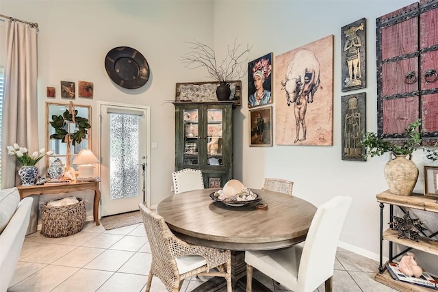 18920 Still Pond Rd, Pflugerville, TX 78660 - dining space featuring light tile patterned flooring and baseboards