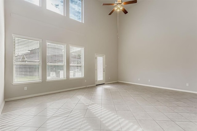 18920 Still Pond Rd, Pflugerville, TX 78660 - unfurnished room featuring a towering ceiling, light tile patterned flooring, and ceiling fan