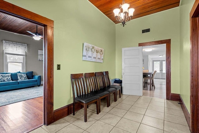 17205 County Line Rd, Elgin, TX 78621 - corridor with wood ceiling, light tile patterned floors, a chandelier, and a high ceiling
