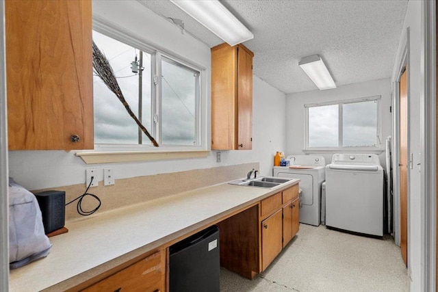 17205 County Line Rd, Elgin, TX 78621 - laundry room featuring separate washer and dryer and a textured ceiling
