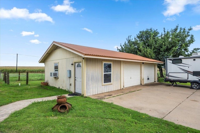 17205 County Line Rd, Elgin, TX 78621 - view of front of home with a detached garage, an outdoor structure, a metal roof, and cooling unit