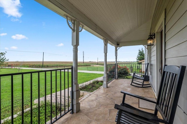 17205 County Line Rd, Elgin, TX 78621 - porch featuring a view of countryside and a lawn