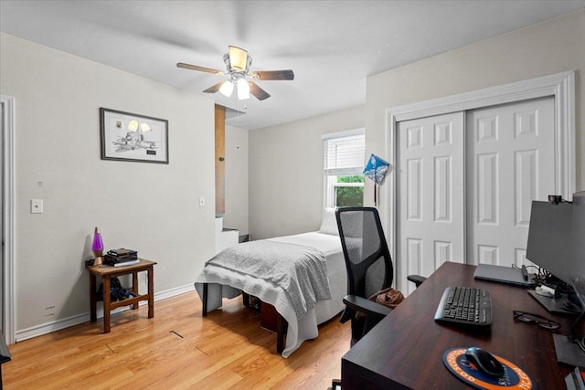 17205 County Line Rd, Elgin, TX 78621 - bedroom with an office area, light wood finished floors, a closet, and ceiling fan