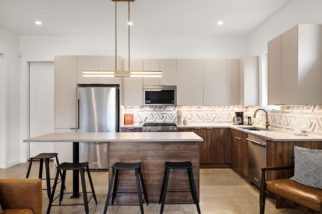 1713 E M Franklin Ave Unit 1, Austin, TX 78721 - kitchen featuring stainless steel appliances, modern cabinets, backsplash, light countertops, and recessed lighting