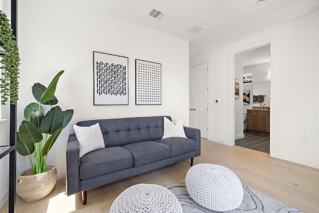 1713 E M Franklin Ave Unit 1, Austin, TX 78721 - living area featuring wood finished floors and baseboards