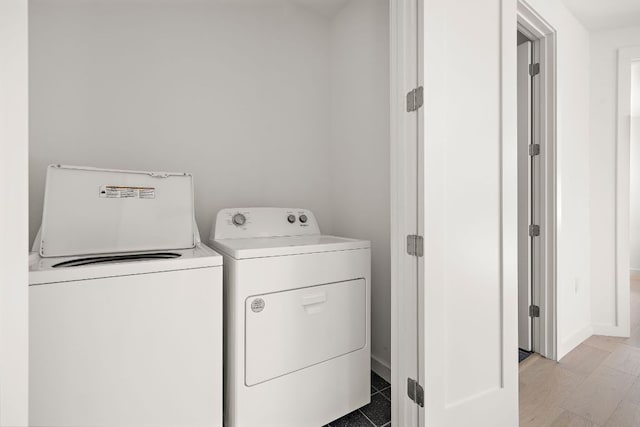 1713 E M Franklin Ave Unit 1, Austin, TX 78721 - laundry room featuring washer and dryer and baseboards