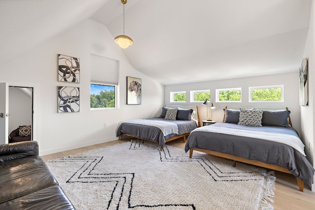 1713 E M Franklin Ave Unit 1, Austin, TX 78721 - bedroom with vaulted ceiling and wood finished floors