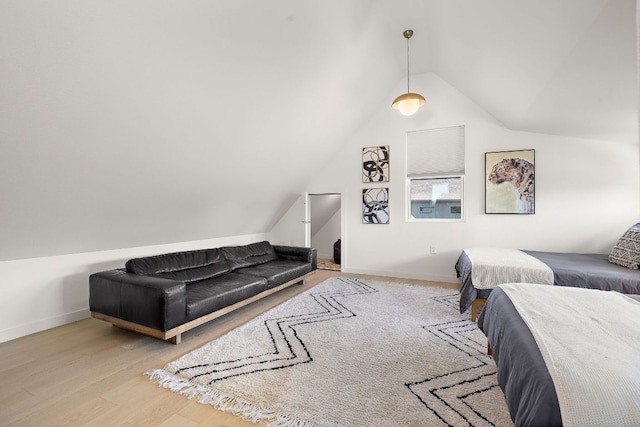 1713 E M Franklin Ave Unit 1, Austin, TX 78721 - bedroom featuring vaulted ceiling and wood finished floors